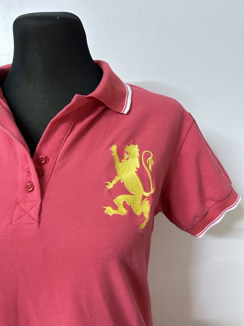 Giordano Polo Dress (Category: Dresses) located in Valenzuela. Submitted by princessjc (Listing ID 1427099292, Image 2). Description: Giordano polo dress in a coral color. Features a yellow lion logo on the chest. It has a collared neckline and short sleeves with white trim. The dress is made of 100% cotton. Perfect for casual wear. Fits - Small - Medium.