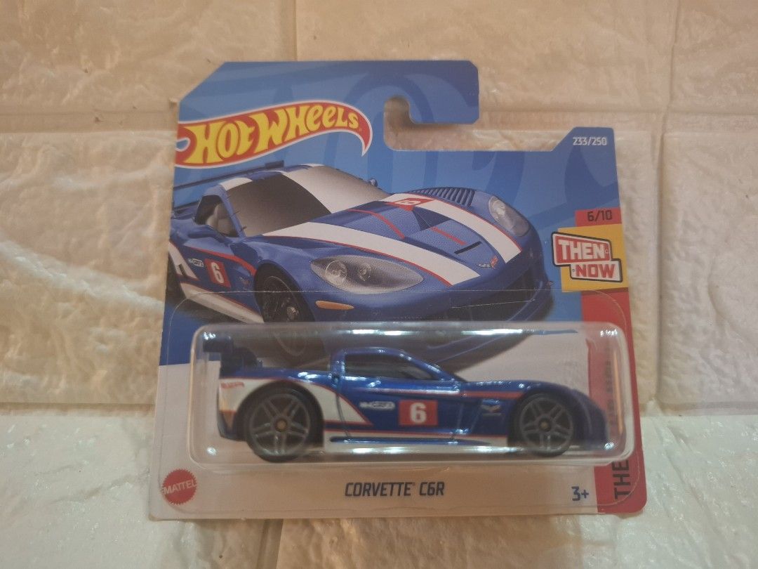 Hot Wheels Corvette C6R (Category: Vehicle & Diecast Models) located in Narvacan. Submitted by jigger85_2ndaccount (Listing ID 1426979217, Image 1). Description: Hot Wheels Corvette C6R diecast car. Features a blue and white color scheme with the number 6 on the side. Part of the Then and Now series. Includes the original packaging..