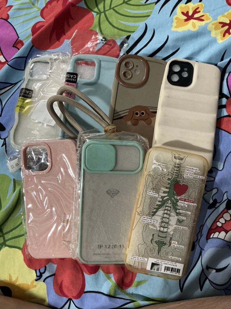 Iphone 12 Cases GET ALL FOR 300 PESOS ONLY (Category: Cases & Sleeves) located in General Trias. Submitted by helaenanana (Listing ID 1427056208, Image 3). Description: - iPhone 12 Case Bundle - Includes multiple designs and styles - Variety of colors - Designs include: puppy, skeleton, and more - Perfect for personal use or gifting - The brown one with the puppy design has never been used, also comes with phone strap.
