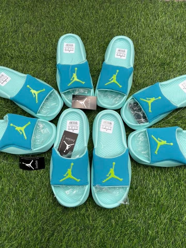 Jordan Hydro 7 Slide Sandals (Category: Sandals) located in Taytay. Submitted by 1920cartel.ph (Listing ID 1427095855, Image 2). Description: Authentic Jordan Hydro 7 slide sandals. Features a teal and green color scheme with the iconic Jumpman logo. The sandals appear to be new, with tags still attached. Comfortable and stylish footwear perfect for casual wear or post-workout recovery. Available in multiple sizes..