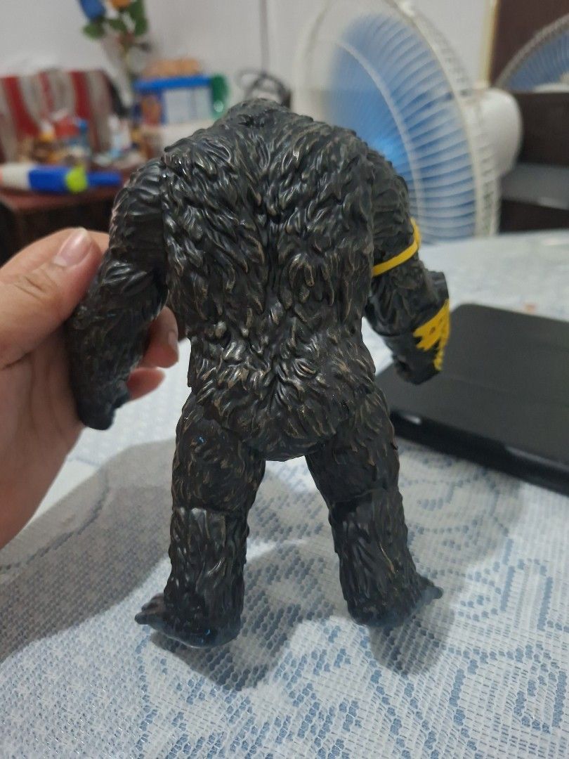 King Kong Action Figure (Category: Figurines & Statues) located in Navotas City. Submitted by alexxiinne (Listing ID 1427034653, Image 2). Description: King Kong action figure features detailed sculpting and articulation. It has a yellow and black arm attachment with the markings "19-LA VT-61". The figure is in a dynamic pose, showcasing its open mouth and detailed fur texture..