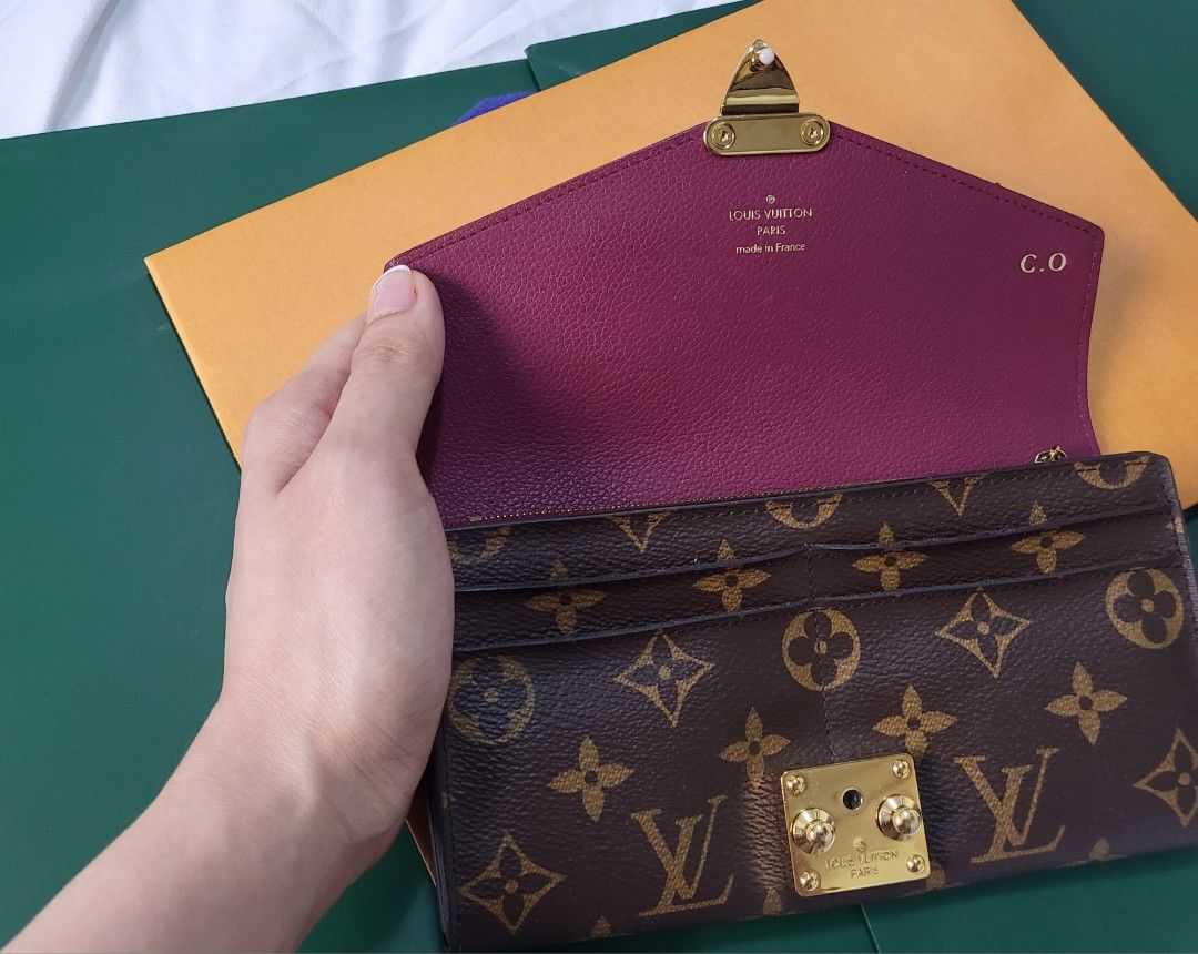 Louis Vuitton Pallas Wallet Large (Category: Luxury Bags & Wallets) located in Mandaluyong City. Submitted by amps.ae (Listing ID 1427123044, Image 3). Description: Guaranteed Authentic with Entrupy Condition : 9/10 very min signs of use. No major flaw. Very spacious can fit iphone promax Inclusions : like new box and paperbag, will add chain to convert to Wallet on chain Note : With Initials.
