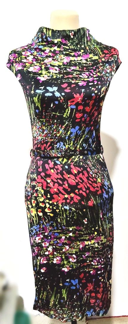 Mango Suit Floral Dress (Category: Dresses) located in Manila. Submitted by audrey03 (Listing ID 1427131851, Image 2). Description: Dress features a vibrant floral print and a stylish high neckline. It includes a matching belt to cinch the waist. The dress is made in Morocco and is composed of 100% polyester. It has a keyhole detail at the back. The size is indicated as S (EUR) and M (MEX)..