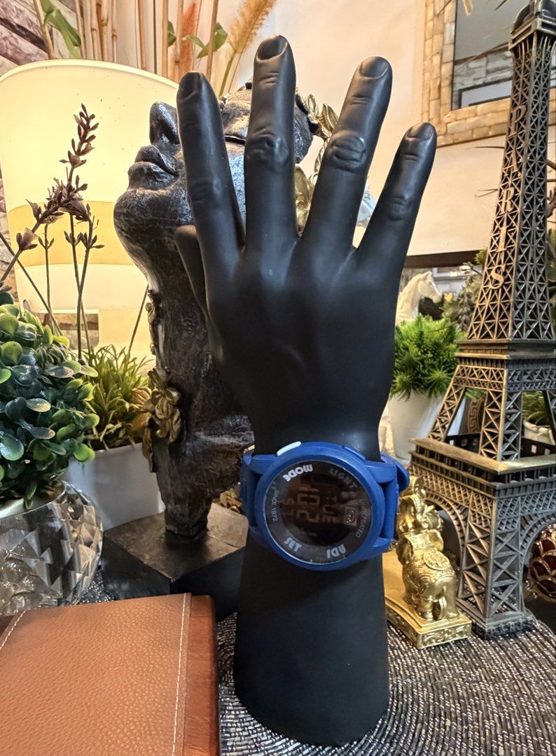 Marc Ecko The 20-20 Blue Rubber Digital Watch (Category: Men's Watches) located in Marikina City. Submitted by landertroy (Listing ID 1426974227, Image 3). Description: Marc Ecko digital watch features a blue rubber strap and case. The watch face displays the time, day, and date. It has light, mode, and set buttons. The back of the watch has the Marc Ecko logo and model number E07503G3. The watch is marked "UNLTD." on the strap..