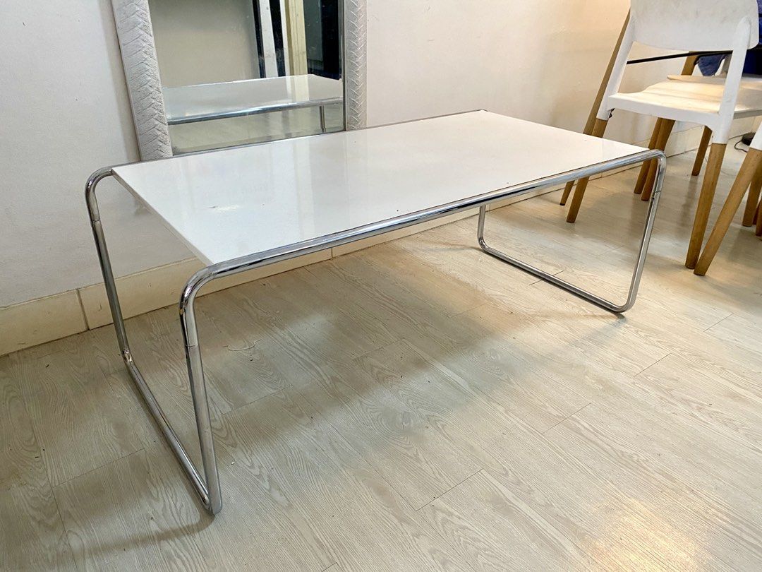 Modern White Coffee Table with Chrome Legs (Category: Tables & Sets) located in Makati City. Submitted by livehorse.a39269 (Listing ID 1426987500, Image 1). Description: Coffee Table For Sale white wood with chrome tubing Newly Plated Chrome 108cm (L) x 55cm (W) x 44 cm (h) Price ₱5,500 Call RC Tulio 09178210266 Pick-up Greenbelt Parkplace Makati .