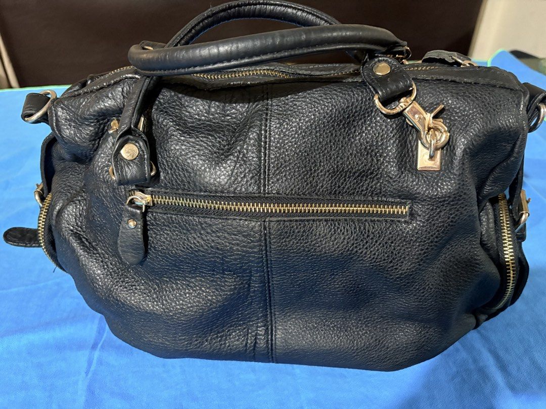 SALE Authentic MOST Black Leather Handbag (Category: Luxury Bags & Wallets) located in Manila. Submitted by truedeclutter (Listing ID 1427011565, Image 3). Description: 14 x 4 x 10 inches Soft leather Genuine leather as seen on tag.