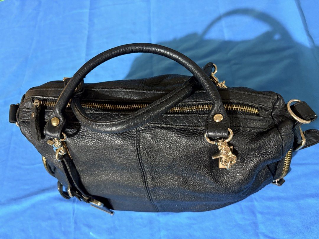 SALE Authentic MOST Black Leather Handbag (Category: Luxury Bags & Wallets) located in Manila. Submitted by truedeclutter (Listing ID 1427011565, Image 2). Description: 14 x 4 x 10 inches Soft leather Genuine leather as seen on tag.