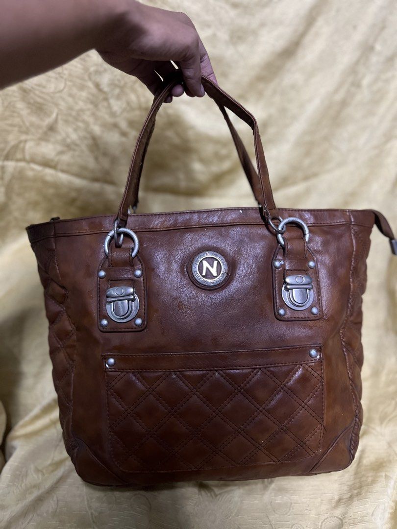 Nicole Miller Brown Tote Bag (Category: Tote Bags) located in Manila. Submitted by moon_2026 (Listing ID 1427026308, Image 1). Description: Nicole Miller bag you can check why is the original price of this bag, what you see is what you get super nice nya!!🩷 .