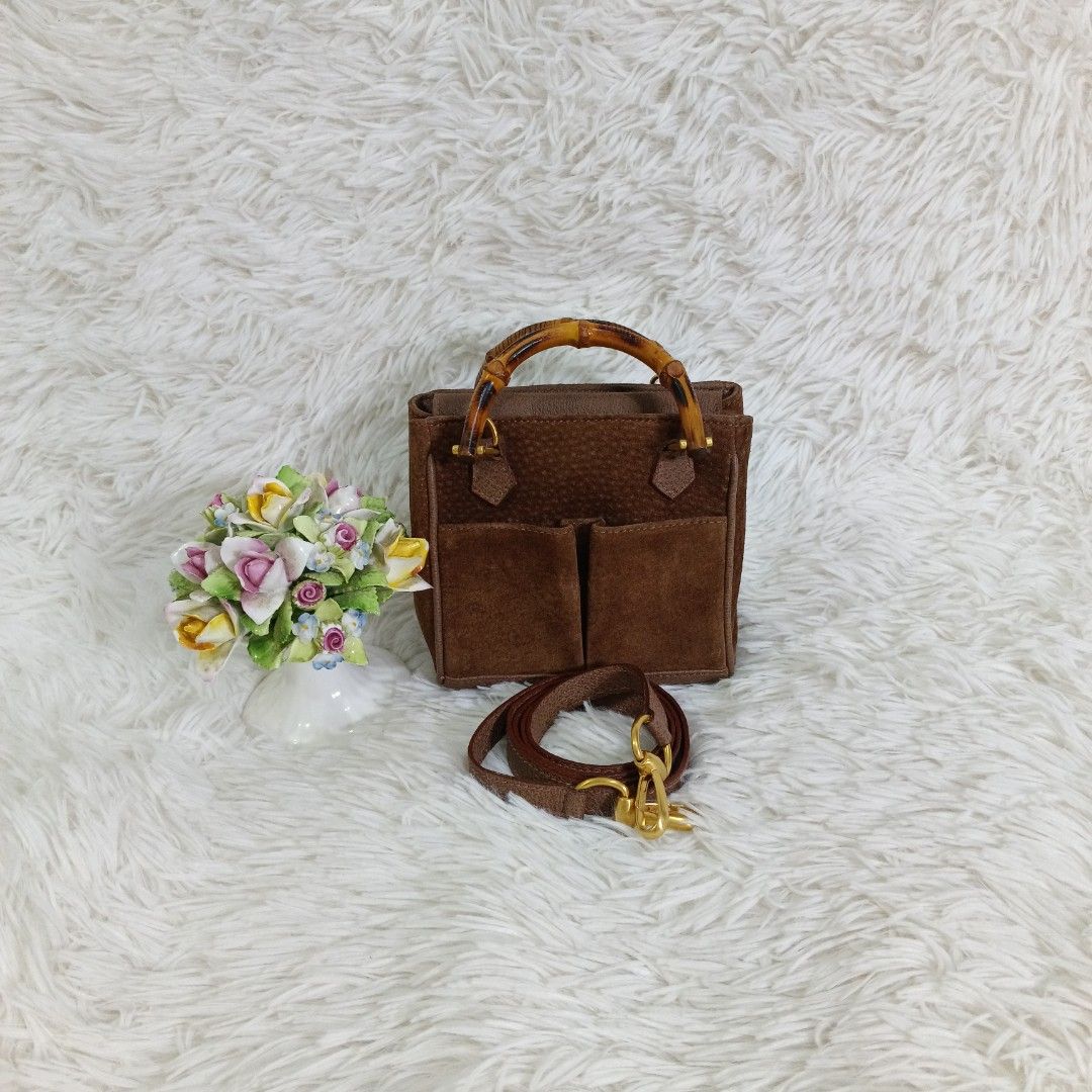 ORIGINAL GUCCI SUEDE BAMBOO MINI 2WAY BAG (Category: Luxury Bags & Wallets) located in Manila. Submitted by bm_bags (Listing ID 1427022376, Image 1). Description: SUPER SALE FIXED NA PO FROM 12K PRICE Guaranteed original ✅ Rank A condition With sling strap /own strap No flaws / clean suede body and also inside clean Gold hardware's pwede pa sa maselan.