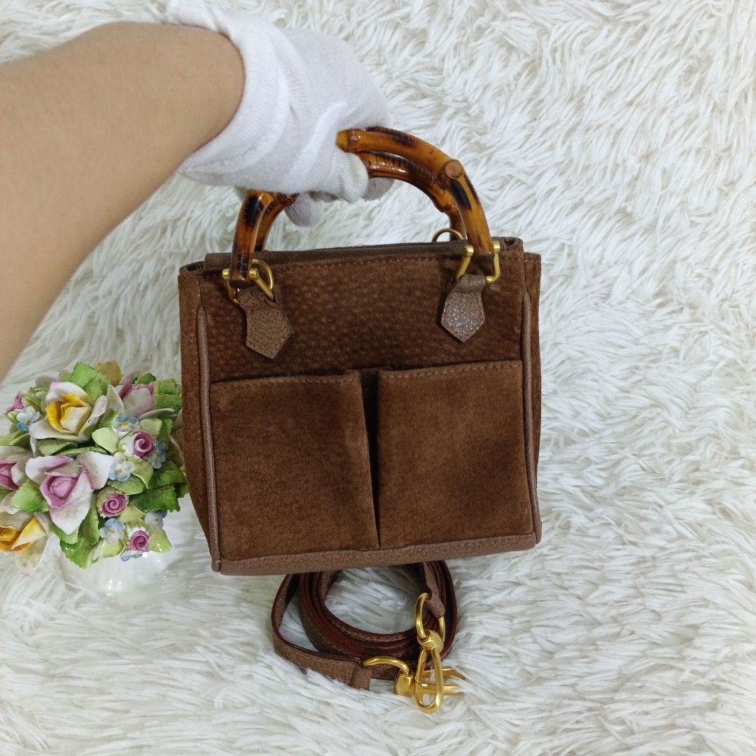 ORIGINAL GUCCI SUEDE BAMBOO MINI 2WAY BAG (Category: Luxury Bags & Wallets) located in Manila. Submitted by bm_bags (Listing ID 1427022376, Image 2). Description: SUPER SALE FIXED NA PO FROM 12K PRICE Guaranteed original ✅ Rank A condition With sling strap /own strap No flaws / clean suede body and also inside clean Gold hardware's pwede pa sa maselan.