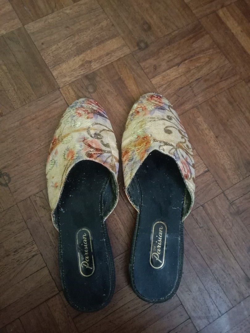 Parisian Floral Slippers (Category: Slippers and slides) located in Marikina City. Submitted by cathdeeee (Listing ID 1426988931, Image 1). Description: Elegant Parisian slippers featuring a floral design. The slippers have a black sole and a cream-colored upper with a colorful floral pattern. The brand name "Parisian" is visible on the insole. These slippers are perfect for casual wear..