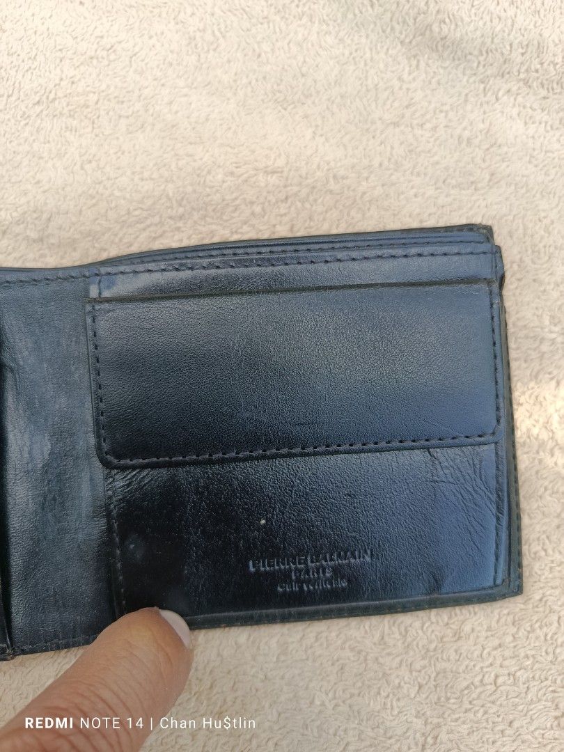Pierre Balmain Black Leather Wallet (Category: Luxury Bags & Wallets) located in Calamba. Submitted by chanmagpantay (Listing ID 1426983823, Image 3). Description: Black leather wallet by Pierre Balmain. Features multiple card slots and a coin pocket. The brand name is embossed on the front and inside. It has a classic bi-fold design..
