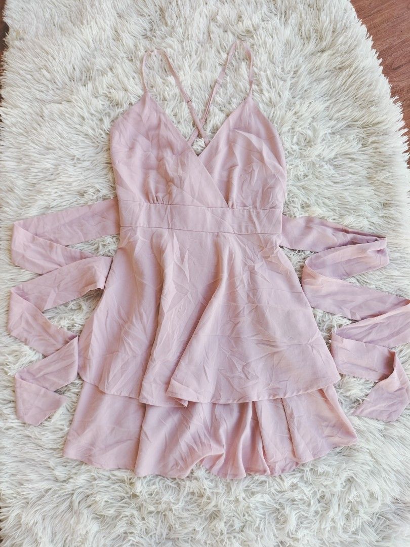 Pink Cami Dress with Tie (Category: Dresses) located in Santo Domingo. Submitted by preeloved.co (Listing ID 1426963351, Image 1). Description: Lovely pink dress features a cami top with a flattering V-neckline and delicate spaghetti straps. It has a layered skirt design and comes with long tie straps that can be styled in various ways. Perfect for a casual day out or a special occasion. The dress is made of a soft, flowing fabric..
