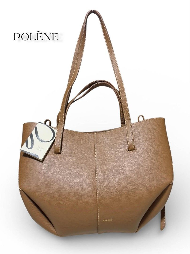 Polène Cyme Mini - Camel Textured Leather (authentic) (Category: Luxury Bags & Wallets) located in Cebu City. Submitted by westleygics18 (Listing ID 1427152200, Image 3). Description: Polène Cyme - Camel Textured Leather (authentic) Brand New with Tag - Interior: 100% cotton twill lining (suede-effect finish) - Convertible design (sides can be tucked in or out) - Two sets of handles (short for hand-carry, long for shoulder-carry) - Magnetic closu