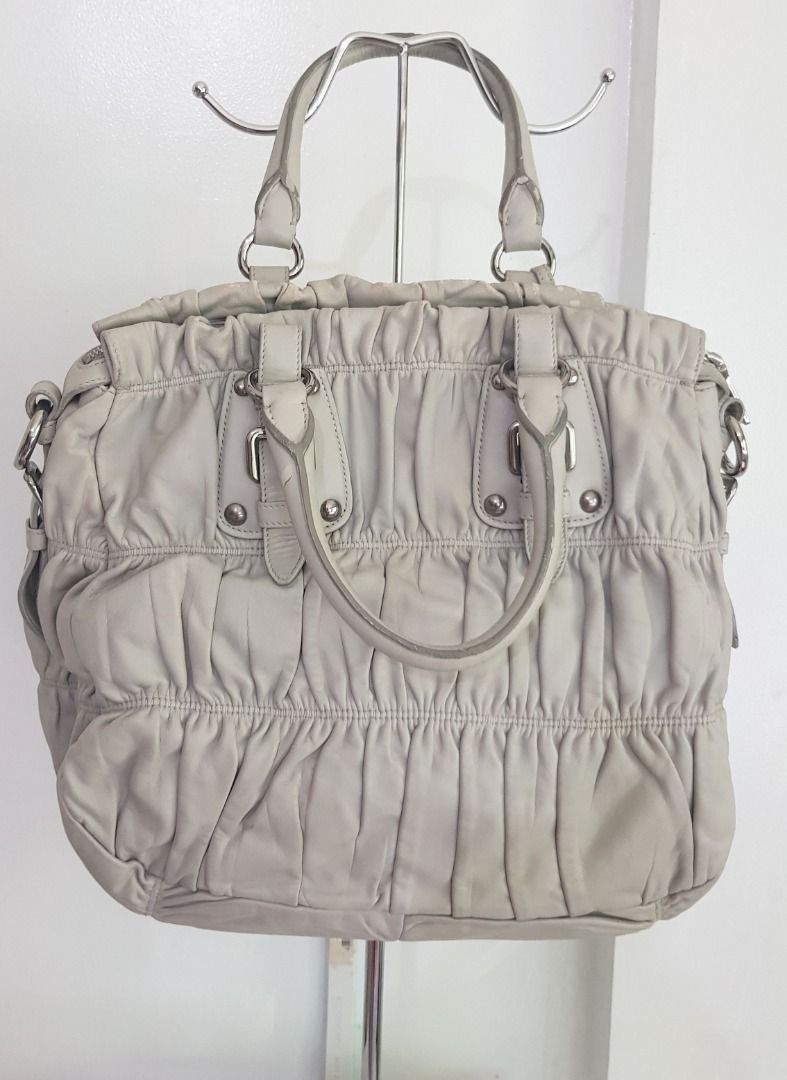 Prada Nappa Leather Gaufre Hand Bag (with Entrupy Cert) (Category: Luxury Bags & Wallets) located in Los Banos. Submitted by mommybabyshopper (Listing ID 1418233180, Image 2). Description: • Authentic Prada bag. With Entrupy Certificate of Authenticity (I will send the link sa buyer) • Bag only, no box/paper bag/dustbag • No crossbody strap (lost strap) • Has scratches/scuffs/rubs sa handles/rubber glazing (you may put twilly to cover), bag's ope