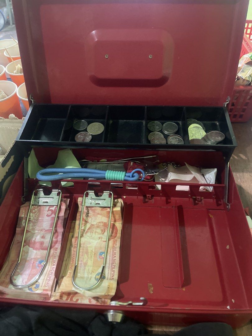 Red Cash Box with Coin Tray (Category: Storage Boxes & Baskets) located in Tuguegarao City. Submitted by bashapopoy87681 (Listing ID 1427008954, Image 1). Description: Red cash box with a removable coin tray. It has two compartments for bills and a separate section for coins. The box is red and has a handle for easy carrying..