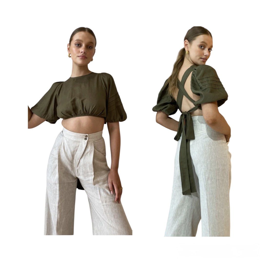 Shona Joy Olive Green Crop Top (Category: Blouses) located in Santa Rosa. Submitted by macobrifashionboutique (Listing ID 1427087913, Image 3). Description: Olive green crop top from Shona Joy. Features a round neckline and short, pleated sleeves. The back has a criss-cross design with a tie closure. .