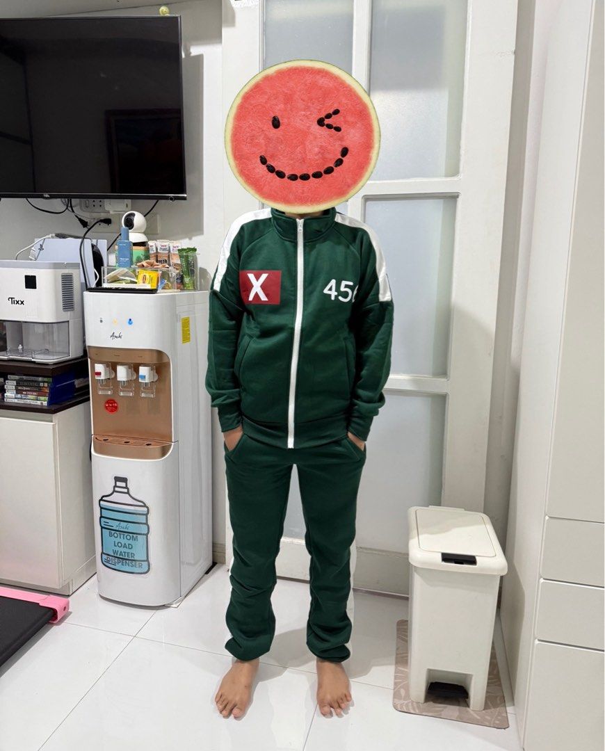 Squid Game Cosplay Costume Set - 3pcs (Category: Sets or Coordinates) located in Taguig. Submitted by familypreloveditems (Listing ID 1427030831, Image 3). Description: Just used once - 3-piece Squid Game Cosplay Set - Includes: Dark green jacket (456), white t-shirt (456), and dark green pants with white stripes - Size: Adult S Condition : very good and no issues .