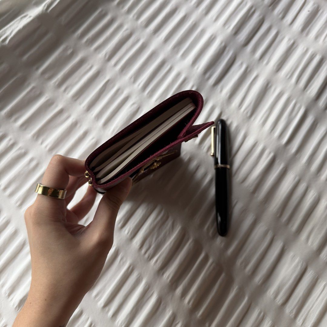starlet - A6 louise carmen inspired journal! (Category: Stationery & School Supplies) located in Makati City. Submitted by jarchives (Listing ID 1427016413, Image 3). Description: - beautiful burgundy leather with sophisticated gold accents - handmade faux leather journal, super good quality leather! - size: A6, trifold - includes two blank inserts! - comes with the charms & lace, super cute base to add more decor! - negotiable if taking more! mo