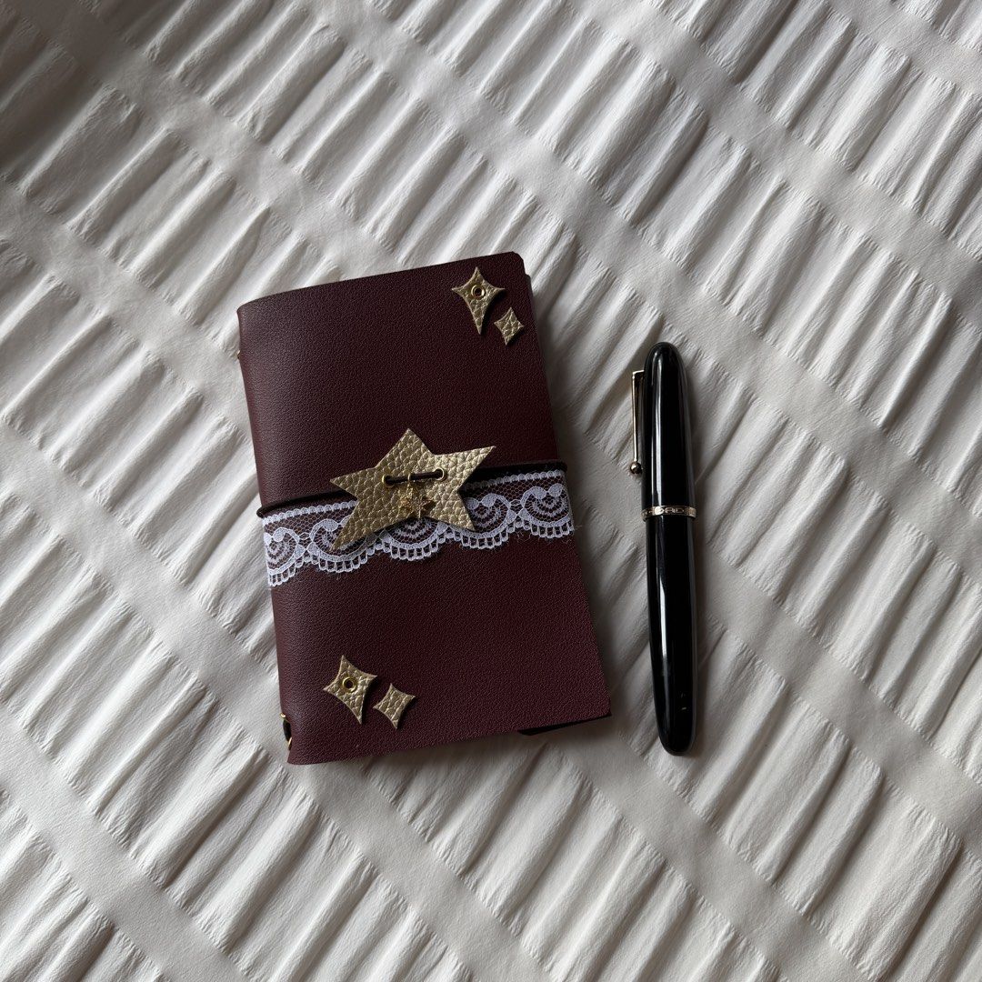 starlet - A6 louise carmen inspired journal! (Category: Stationery & School Supplies) located in Makati City. Submitted by jarchives (Listing ID 1427016413, Image 1). Description: - beautiful burgundy leather with sophisticated gold accents - handmade faux leather journal, super good quality leather! - size: A6, trifold - includes two blank inserts! - comes with the charms & lace, super cute base to add more decor! - negotiable if taking more! mo