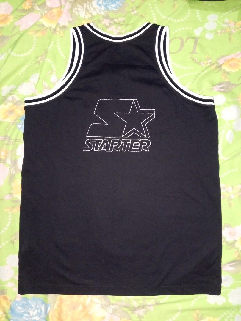 Starter x Emily the Strange Tank Top (Category: Activewear) located in Magalang. Submitted by zeiansoria64090 (Listing ID 1427101954, Image 2). Description: Black Starter tank top featuring an Emily the Strange collaboration design. The front has an Emily the Strange logo and the words "good kitty gone bad." The back has a large Starter logo. It is a size M-L. Made in China..