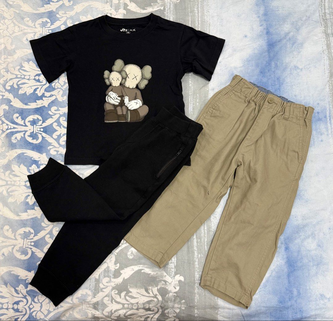 Uniqlo UT KAWS Graphic Tee & Pants Set (Category: Babies & Kids Fashion) located in Cavite. Submitted by prelovedstuff28179 (Listing ID 1427150833, Image 1). Description: - Uniqlo UT KAWS graphic tee (black) - Black pants with zipper detail - Khaki pants with elastic waistband likenew condition take all only 110 size used once or twice lang .