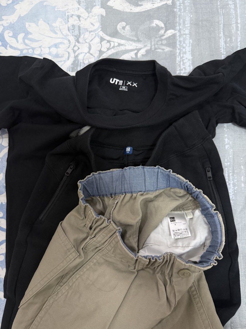 Uniqlo UT KAWS Graphic Tee & Pants Set (Category: Babies & Kids Fashion) located in Cavite. Submitted by prelovedstuff28179 (Listing ID 1427150833, Image 2). Description: - Uniqlo UT KAWS graphic tee (black) - Black pants with zipper detail - Khaki pants with elastic waistband likenew condition take all only 110 size used once or twice lang .