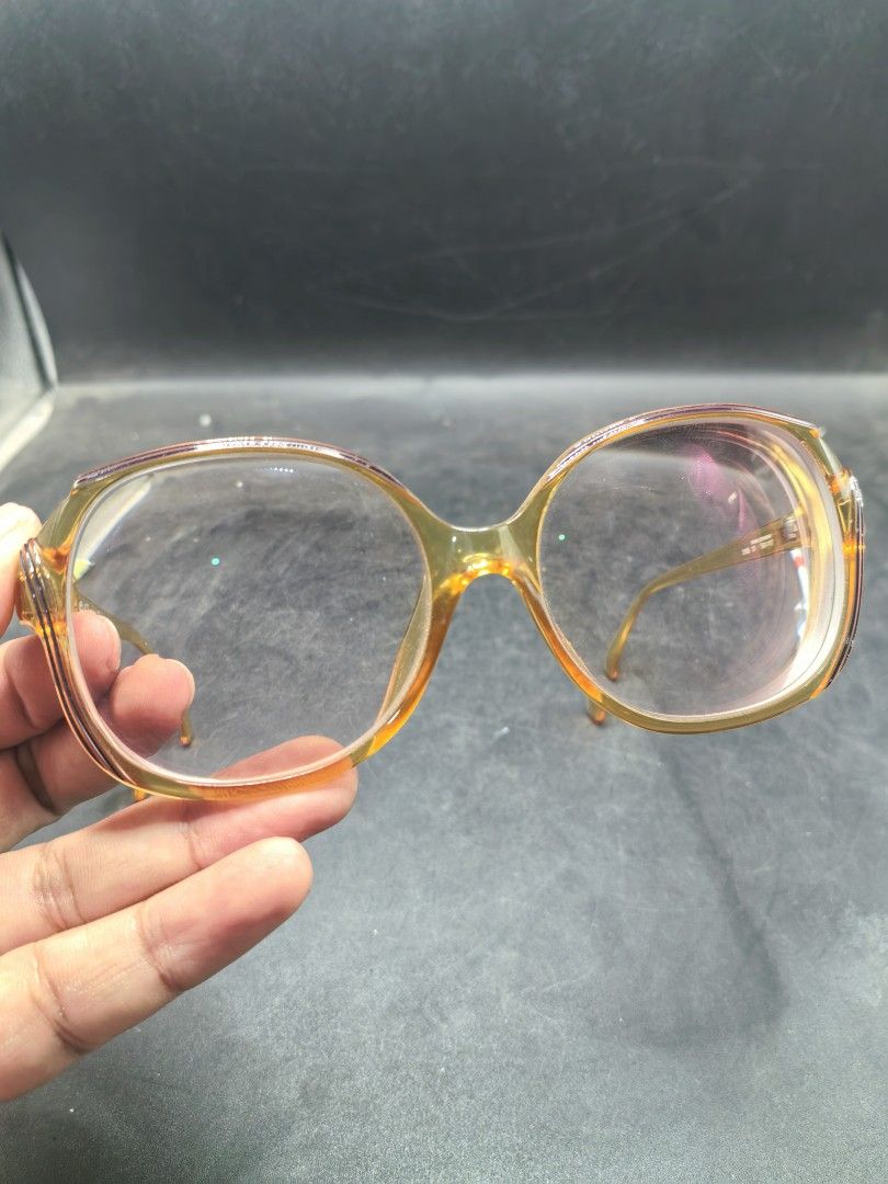 Vintage Branded Eyewear Frame (Pre-Loved) (Category: Sunglasses & Eyewear) located in Cebu City. Submitted by dudes_villanueva (Listing ID 1427033186, Image 3). Description: Eye Glasses - Vintage Branded Eyewear Frame (Pre-Loved) 📌Likely from the 1970s or 1980s, matching the "2035" model known for its orange/amber coloring and oval shape. 📌Era: Vintage (1970s-1980s) 📌Material/Style: Made with Optyl material, featuring a bold, oversized oval sh