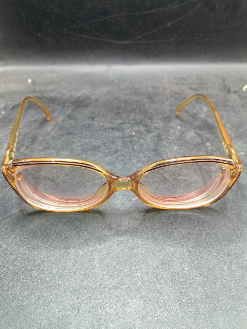 Vintage Branded Eyewear Frame (Pre-Loved) (Category: Sunglasses & Eyewear) located in Cebu City. Submitted by dudes_villanueva (Listing ID 1427033186, Image 2). Description: Eye Glasses - Vintage Branded Eyewear Frame (Pre-Loved) 📌Likely from the 1970s or 1980s, matching the "2035" model known for its orange/amber coloring and oval shape. 📌Era: Vintage (1970s-1980s) 📌Material/Style: Made with Optyl material, featuring a bold, oversized oval sh