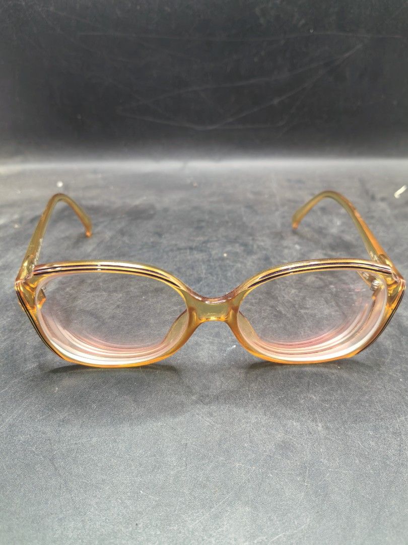 Vintage Branded Eyewear Frame (Pre-Loved) (Category: Sunglasses & Eyewear) located in Cebu City. Submitted by dudes_villanueva (Listing ID 1427033186, Image 1). Description: Eye Glasses - Vintage Branded Eyewear Frame (Pre-Loved) 📌Likely from the 1970s or 1980s, matching the "2035" model known for its orange/amber coloring and oval shape. 📌Era: Vintage (1970s-1980s) 📌Material/Style: Made with Optyl material, featuring a bold, oversized oval sh