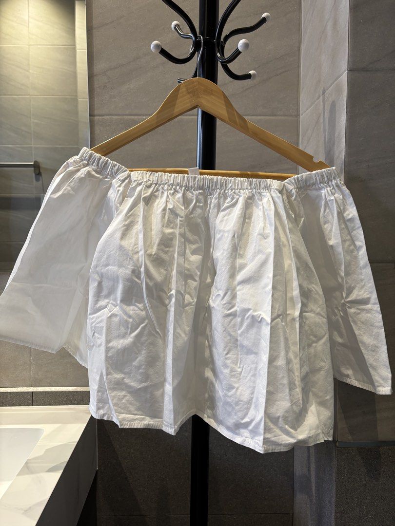 White Off-Shoulder Top (Category: Blouses) located in Guiguinto. Submitted by positivemind (Listing ID 1426985599, Image 1). Description: Sleeve is slightly torn but can be repaired with stitching. Never worn. Location: Sta. Cruz Guiguinto Bulacan .