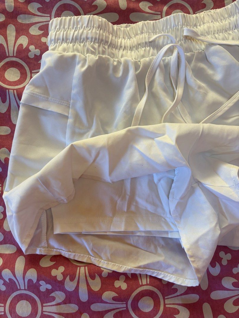 Woman Active White Shorts - Size M (Category: Shorts) located in Cebu City. Submitted by conductdisorder (Listing ID 1426984522, Image 3). Description: White shorts with an elastic waistband and drawstring. Features a built-in lining and pockets. The shorts are labeled as size M. Perfect for active wear or casual outings. Made by Woman Active..
