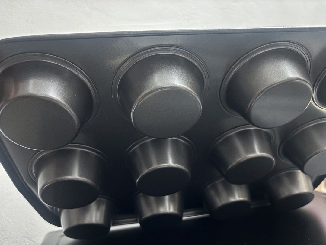 12-Cup Muffin Pan (Category: Bakeware) located in Makati City. Submitted by hercloset.daze (Listing ID 1427227652, Image 3). Description: • 12 Cup Muffin/Cupcake pan •Brand new but it has minor dents •RFS: Wrong size was ordered Shipping : Lalamove.