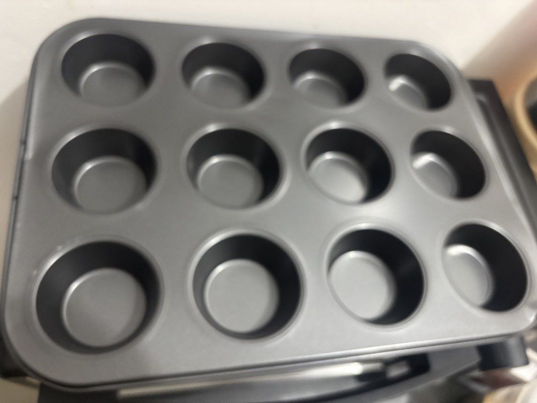 12-Cup Muffin Pan (Category: Bakeware) located in Makati City. Submitted by hercloset.daze (Listing ID 1427227652, Image 2). Description: • 12 Cup Muffin/Cupcake pan •Brand new but it has minor dents •RFS: Wrong size was ordered Shipping : Lalamove.