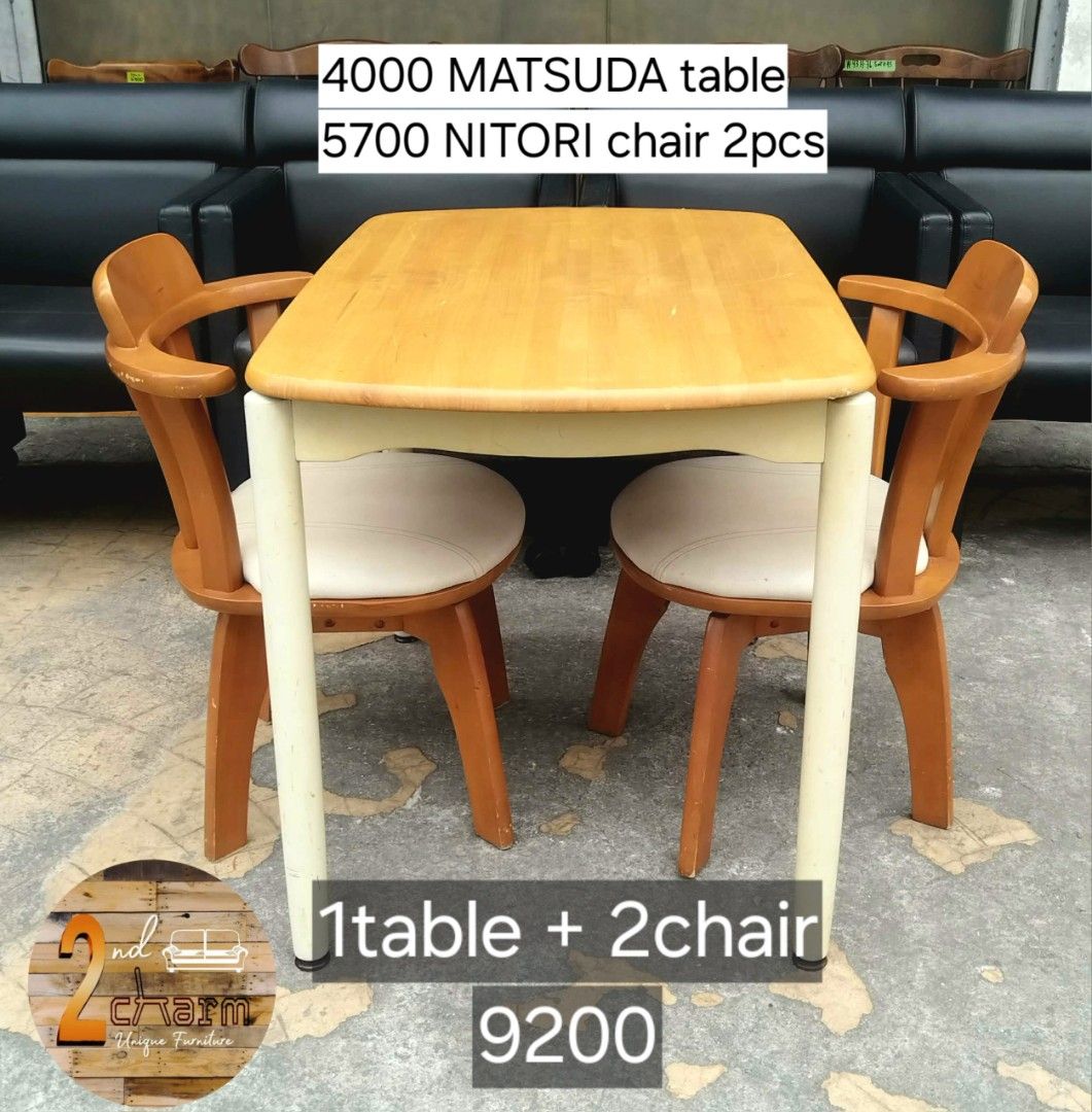 2nd hand MATSUDA Table + NITORI Swivel Chairs Dining Set (Category: Tables & Sets) located in Paranaque City. Submitted by 2ndcharmfurniture (Listing ID 1427263288, Image 1). Description: Dining set includes a Matsuda table and two Nitori chairs. The table is made in Japan and measures L90 x W60 x H70cm. The chairs are L44 x D44 x H70cm, with a seat height of 40cm. The table has a light wood top with off-white legs. The chairs have wooden frames 