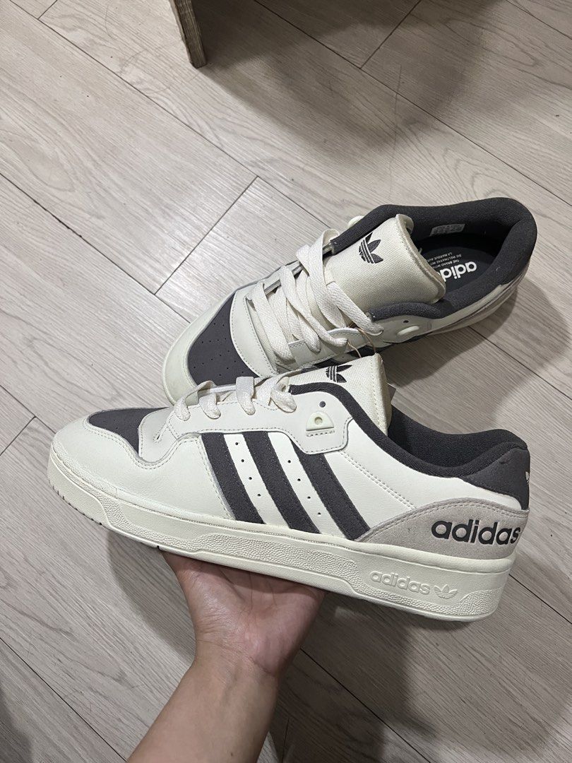 Adidas Rivalry Low Shoes (Category: Sneakers) located in Quezon City. Submitted by dolly_girl_stuffs (Listing ID 1427296804, Image 1). Description: Original Adidas Rivalry Low Shoes - Beige With Tag, Fitted, No Box Size: US 12 | UK 11.5 Original price: Php 3000 Price still negotiable. RFS: Big size, unused Payment first via GCash .