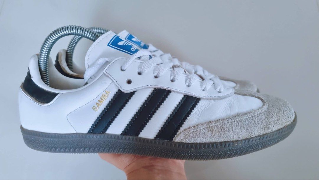 Adidas Samba White Black Sneakers (Category: Sneakers) located in Danao, Cebu. Submitted by altheaprelovedcorner (Listing ID 1427307753, Image 3). Description: Adidas Samba sneakers in white with black stripes. Features a grey suede toe cap and a grey sole. The Adidas logo is visible on the tongue and the sole. The shoes are size US 7, UK 6.5, FR 40, JP 250, and CHN 245. Made in Vietnam..