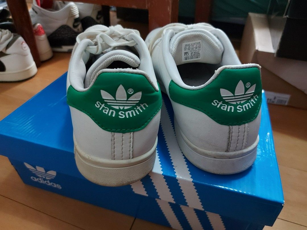 Adidas Stan Smith White Green Sneakers (Category: Sneakers) located in Las Pinas. Submitted by erikashoppe (Listing ID 1427200763, Image 2). Description: Classic Adidas Stan Smith sneakers in white with green accents. Features the iconic Stan Smith logo on the heel. Includes the original Adidas box. The shoes have white laces and the Adidas logo is visible on the side and tongue of the shoe..