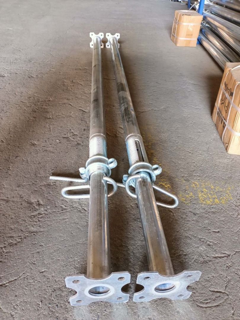 Adjustable Scaffolding Props (Category: Construction & Building Materials) located in Consolacion. Submitted by guoruicebu48978 (Listing ID 1427219736, Image 1). Description: Pair of adjustable scaffolding props. They have a threaded adjustment mechanism and a base plate with holes for securing. Ideal for construction or renovation projects. The props are designed to provide support and stability..