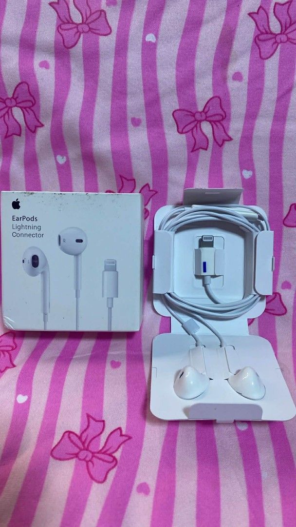 Apple EarPods with Lightning Connector (Category: Earphones) located in Manila. Submitted by milasgadgetph (Listing ID 1427310819, Image 1). Description: Genuine Apple EarPods with Lightning Connector. Comes with the original box and packaging. The earphones are white. The Lightning connector is also white. The box has the Apple logo and the words "EarPods Lightning Connector"..
