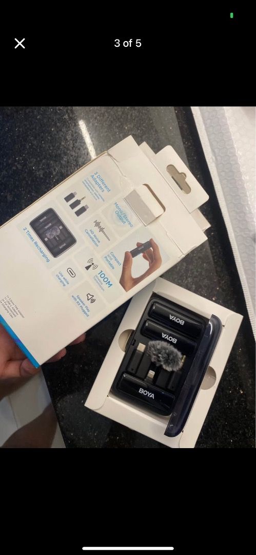 BOYA BY-B02 Wireless Lavalier Microphone (Category: Microphones) located in Caloocan City. Submitted by xandravill22872 (Listing ID 1427208801, Image 2). Description: Almost New! BOYA BY-B02 wireless lavalier microphone system. Includes two microphones, a charging case, and various adapters. The charging case has a built-in battery. The system is designed for iPhone and Android devices. It has a 2.4GHz dual-channel wireless microphone system. The