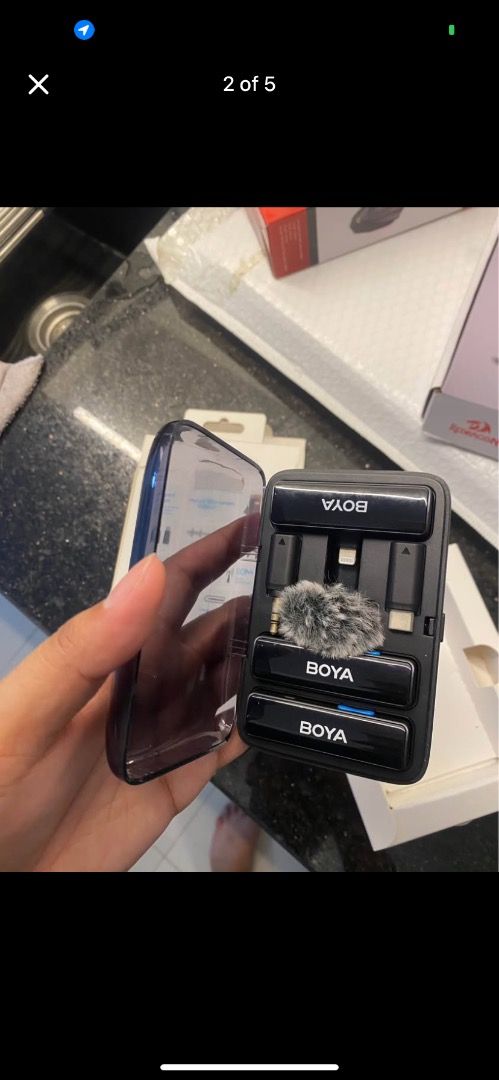 BOYA BY-B02 Wireless Lavalier Microphone (Category: Microphones) located in Caloocan City. Submitted by xandravill22872 (Listing ID 1427208801, Image 1). Description: Almost New! BOYA BY-B02 wireless lavalier microphone system. Includes two microphones, a charging case, and various adapters. The charging case has a built-in battery. The system is designed for iPhone and Android devices. It has a 2.4GHz dual-channel wireless microphone system. The
