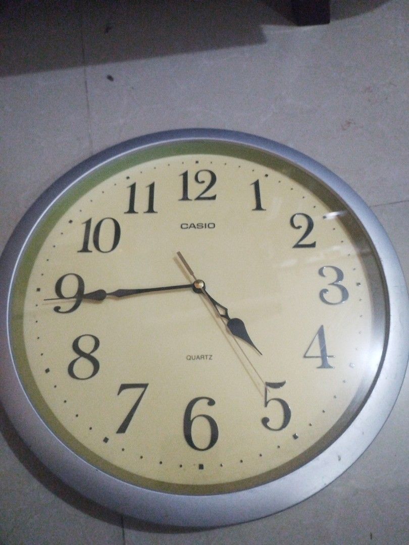 Casio Round Wall Clock (13 inches diameter) (Category: Clocks) located in San Rafael. Submitted by jflshoppe1989 (Listing ID 1427230285, Image 1). Description: Round wall clock. The back of the clock is visible, showing the battery compartment and the clock mechanism. The clock has a cream-colored frame. The clock mechanism has a label that says "LW 325"..
