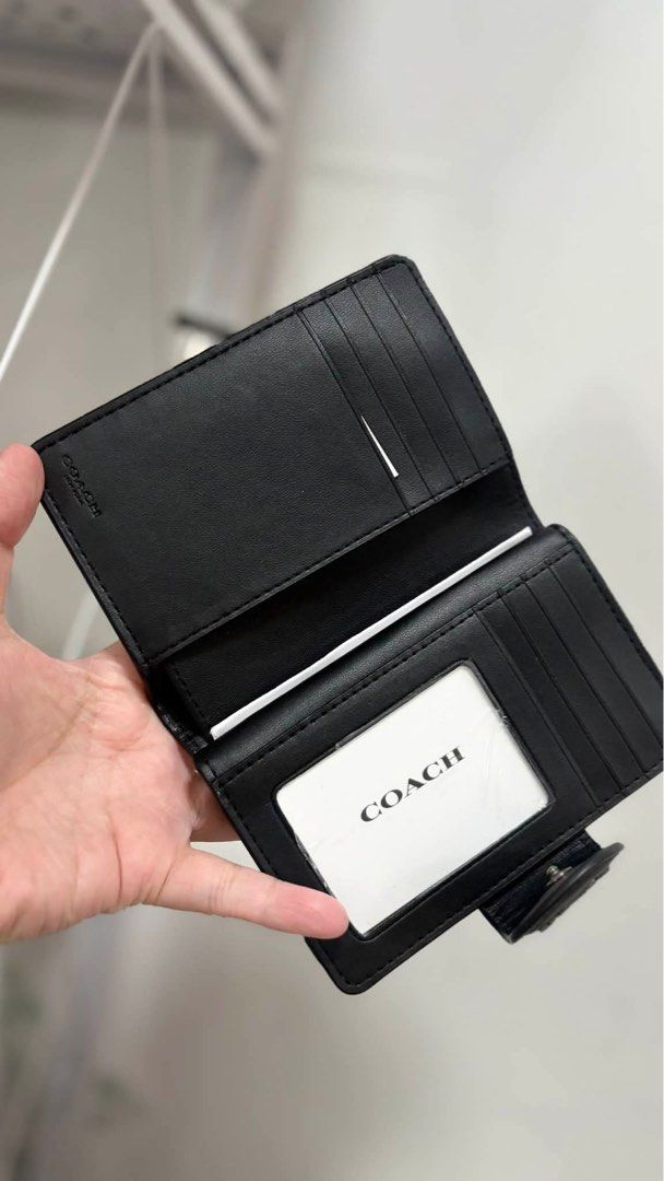 Coach Black Signature Wallet (Category: Luxury Bags & Wallets) located in Marikina City. Submitted by airamarie999 (Listing ID 1427164769, Image 3). Description: 𝗖𝗢𝗔𝗖𝗛 𝗦𝗶𝗴𝗻𝗮𝘁𝘂𝗿𝗲 𝗠𝗲𝗱𝗶𝘂𝗺 𝗖𝗼𝗿𝗻𝗲𝗿 𝗭𝗶𝗽 𝗪𝗮𝗹𝗹𝗲𝘁 🤎 Signature coated canvas with smooth leather trim 💳 Multiple card slots for organized storage 🪙 Zip coin pocket for loose change 📂 Bill compartment for folded cash ✨ Gold-tone 𝗖𝗢𝗔𝗖𝗛 logo hardware 📏 Com