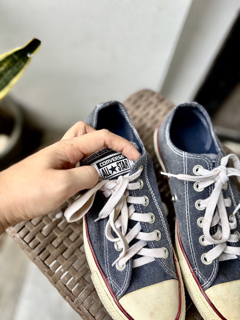 Converse All Star Low Top denim Sneakers (Category: Sneakers) located in Las Pinas. Submitted by dthreeonlineshop (Listing ID 1427173055, Image 3). Description: Classic Converse All Star low top sneakers in a denim-like blue. Features white laces, a cream-colored toe cap with a red stripe, and the iconic Converse All Star logo on the heel. The soles show some wear. Made in Vietnam. Size is US 4.5, UK 4.5, EUR 37, and 23.5 cm. .