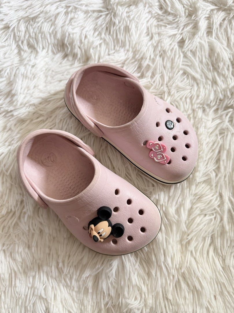 Crocs Kids Pink Clogs with Jibbitz (Category: Babies & Kids Fashion) located in Tuguegarao City. Submitted by declutteringmommaaa (Listing ID 1427243840, Image 2). Description: Size: C7 good used condition as seen.