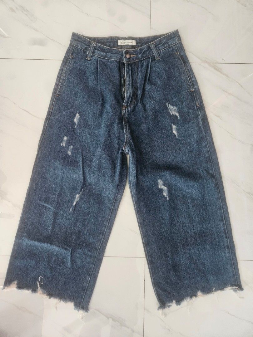 Distressed Denim Jeans (Category: Jeans) located in Manila. Submitted by declutterhopper (Listing ID 1427214408, Image 1). Description: Stylish denim jeans with a distressed design. Features a button closure and a zipper. The jeans have a raw hem. The waist measures approximately 30 inches. The length is approximately 78 cm. The brand is Shi Zine Fashionwear..