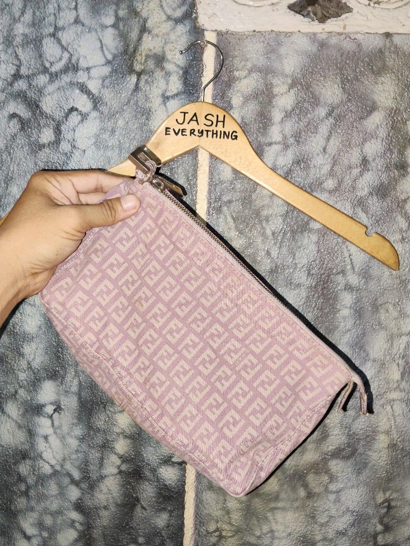 Fendi Zucca Pink Shoulder Bag (Category: Luxury Bags & Wallets) located in City of Isabela. Submitted by jasheverything (Listing ID 1427308651, Image 1). Description: Authentic Fendi clutch in pink. Features the iconic FF logo pattern. The zipper has a Fendi logo. The interior has a small leather tag with the Fendi logo and "Made in Italy" printed on it. Includes a fabric tag with the Fendi logo and care instructions. The clutch has a rectangular