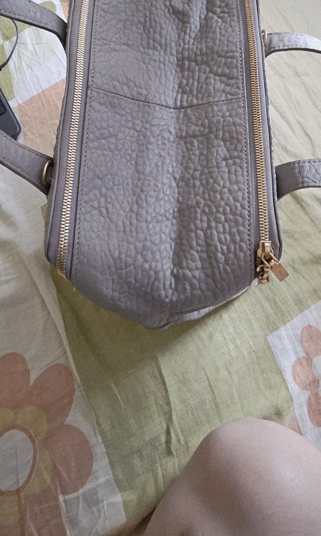 Grey Handbag with Gold Accents (Category: Luxury Bags & Wallets) located in Paranaque City. Submitted by dacucs.24 (Listing ID 1427264134, Image 2). Description: -OG COURRONE -GREY -2,000 .