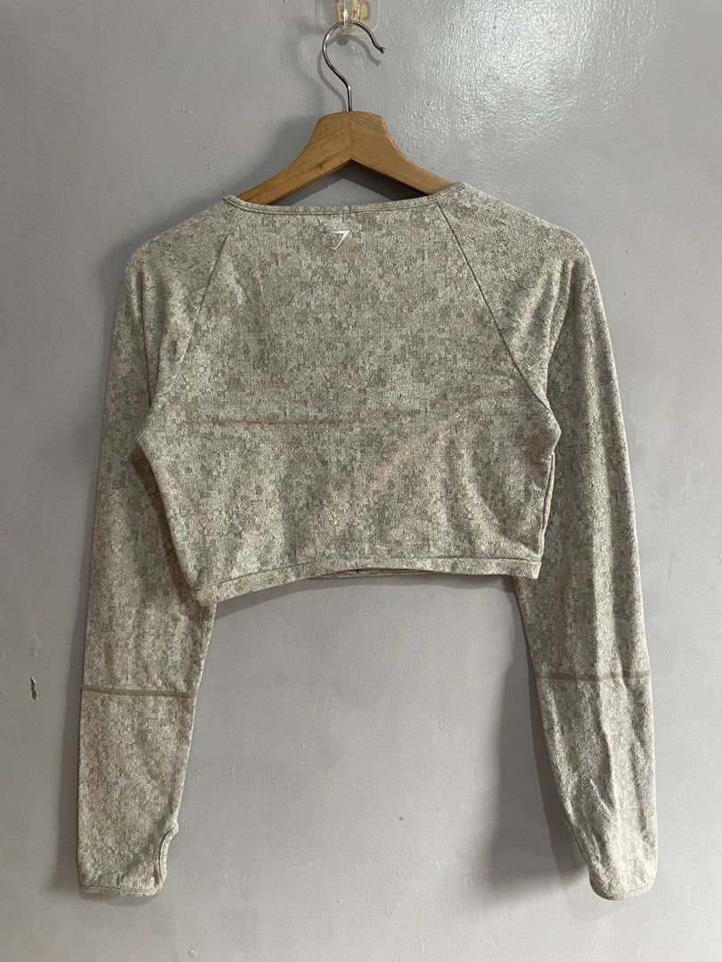 Gymshark Cropped Long Sleeve Top (Category: Activewear) located in Taguig. Submitted by _curatedfits (Listing ID 1427297035, Image 3). Description: Gymshark Fleur Texture Long Sleeve Crop Size: Medium base on dimensions W 16 L 14 No flaws - 250 Dm!.